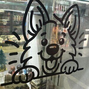 decal featuring an adorable peeking puppy design